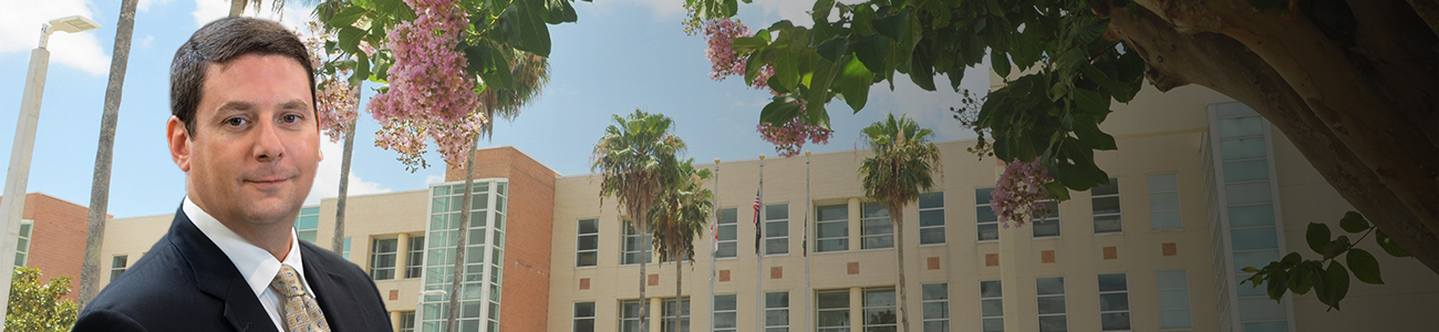 Jordan H. Kramer with the Harry T. and Harriette V. Moore Justice Center (Viera Courthouse) in the background.